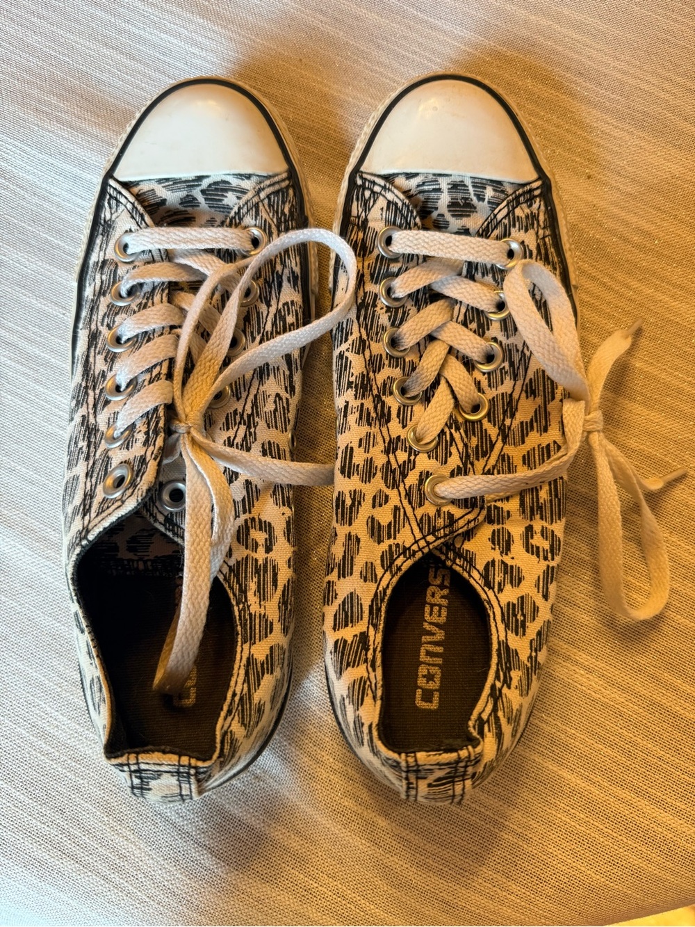 Converse Women’s Leopard Print Low Top Sneakers in Black and White